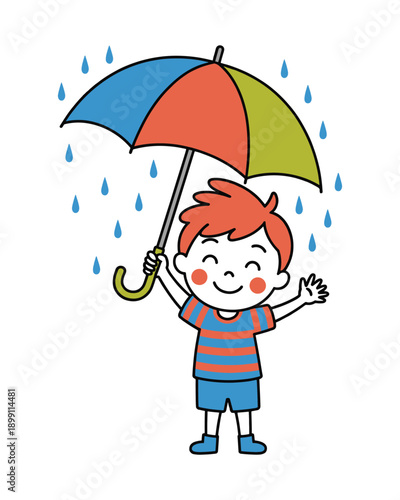 Caucasian boy holding a multicolored umbrella on a rainy day outside