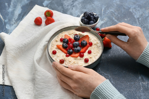 Female hands with tasty oat...