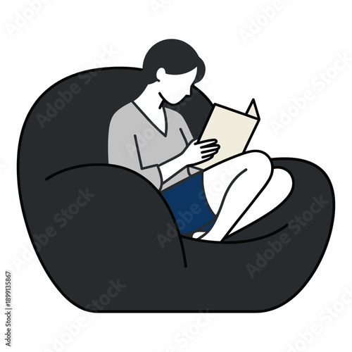 Person with dark hair sits comfortably in a large dark beanbag chair engrossed in reading a light colored book sitting leisure relaxation home indoor hobby lifestyle knowledge
