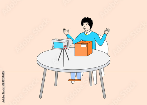 Man sitting at a table with a box in front of him