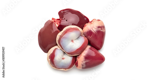 Pile of raw chicken giblets including hearts and gizzards isolated on white background for coo