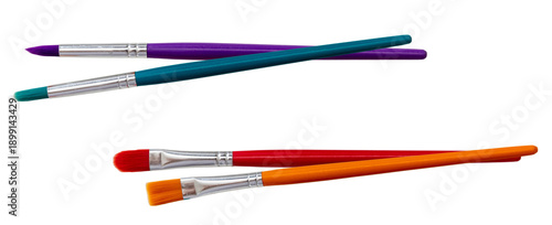 set of four diverse paintbrushes with colored handles, artistic tools for painting and crafting projects.
