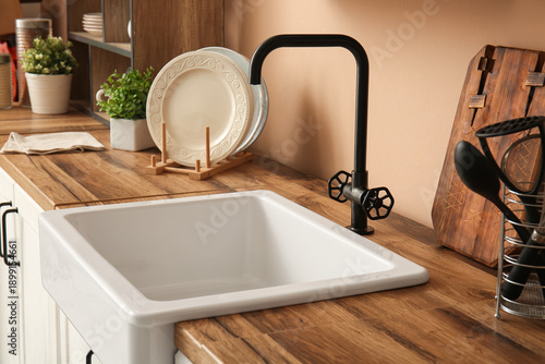 Ceramic sink on wooden coun...