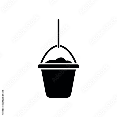 Bucket with sand hanging from a rope.