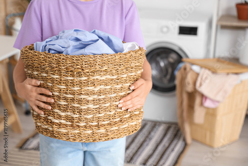 Young woman with basket of ...