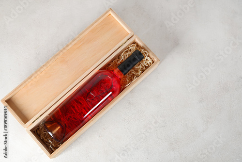 Box with bottle of wine on ...