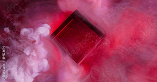 Dye cube. Neon cloud texture. Red purple color shiny splash vapor smoke water fume pigment spill on abstract defocused art background.