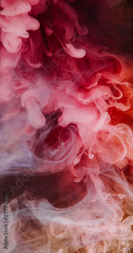 Paint fume splash. Underwater mist. Defocused orange pink purple color cloud glitter liquid smoke texture spreading on abstract background.