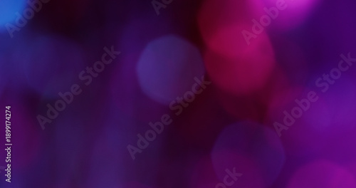 Defocused gleam light. Neon bokeh glare. Purple pink blue color glimmer round texture sparkling optical glint shiny on abstract art background.