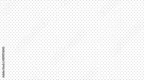 Gray polka dot pattern on white background. Subtle variations in dot size and spacing create a textured visual