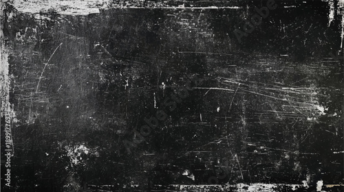 Black distressed surface with white scratches and smudges texture grunge