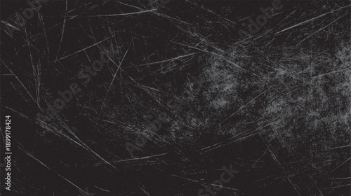 Dark gray textured background with numerous fine white and light gray scratches and scuffs across the surface