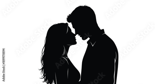 Silhouette of a couple facing each other appearing to be about to kiss