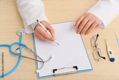 Doctor writing medical repo...