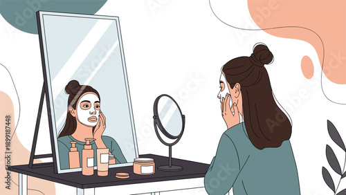 Young woman applying a white facial mask while looking at her reflection in a large vanity mirror at home for a skincare routine.