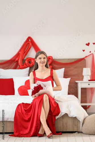 Young woman with roses sitt...