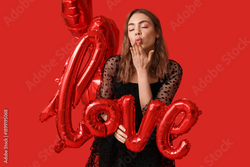 Young woman with word LOVE ...
