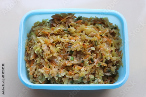 Homemade vegetable dumpling filling in a bowl, prepared for traditional momos, with minced cabbage, carrots, and ginger.
Top view of seasoned vegetable momo stuffing, a healthy plant-based appetizer i