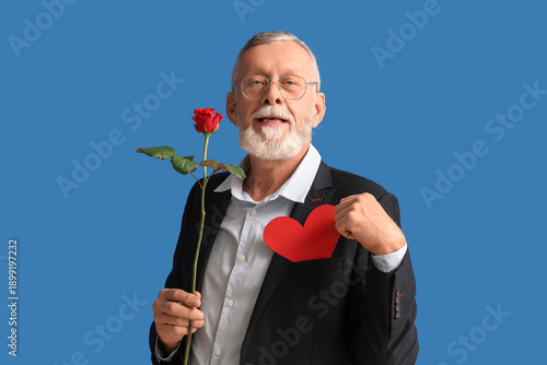 Mature man with rose flower...