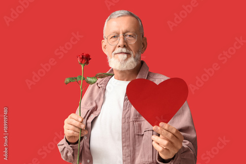 Mature man with rose flower...