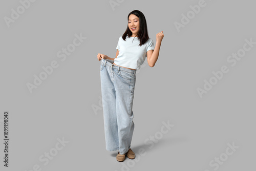 Beautiful young happy Asian...