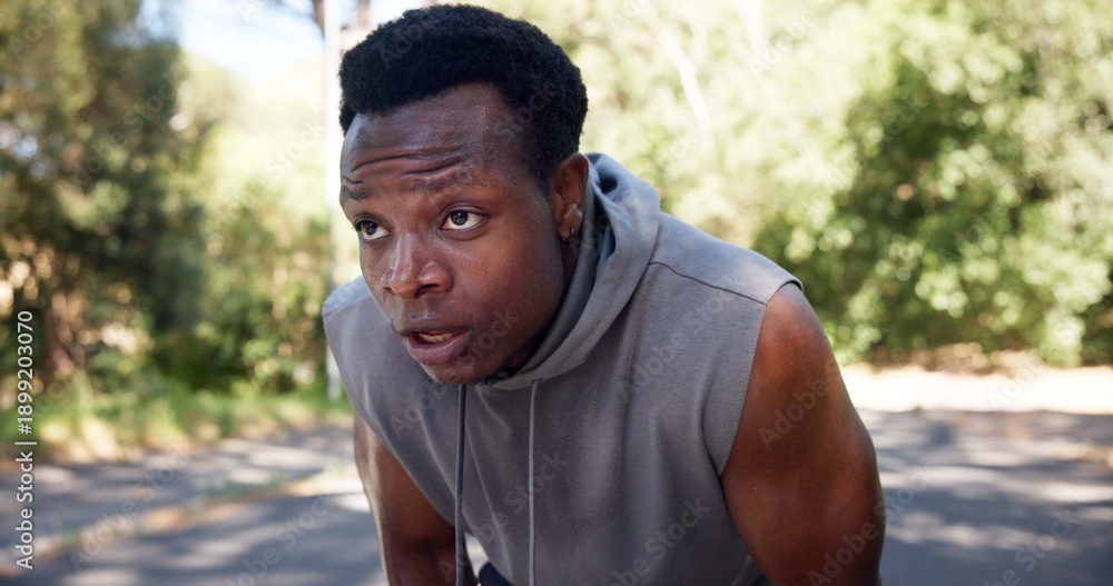 Fototapeta premium Tired, black man and outdoor with sweat from cardio workout, exercise challenge and sports fatigue. Exhausted person, breathe and fitness in road with training break, rest and recovery for wellness.