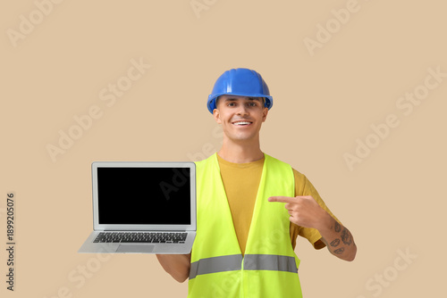 Young male engineer pointin...