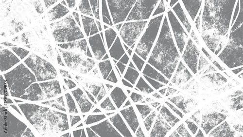 Abstract pattern of overlapping white lines on a textured gray background with a stippled effect