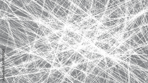 Dense white chaotic scribbles and lines overlaying a solid grey background creating a textured abstract pattern