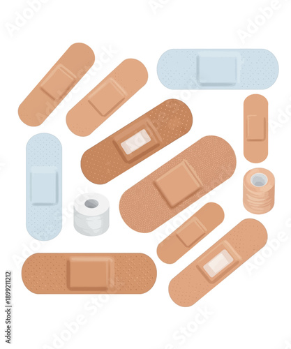A collection of assorted adhesive bandages and medical tape rolls representing first aid supplies for minor wound care applications on white background