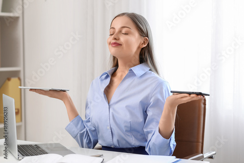 Young businesswoman with ta...