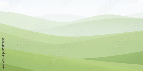 A vibrant summer landscape features green rolling hills and a lush meadow under a blue sky with white clouds, showcasing a scenic mountain valley view where nature meets the rural horizon