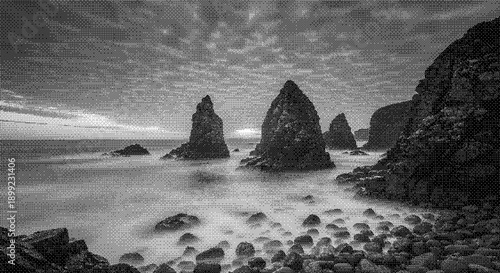 Rugged rocky shoreline with prominent triangular rock formations at dusk, captured in a serene black and white landscape from a low vantage point.