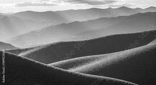 Rolling hills and mountains viewed from a high vantage point in black and white photography