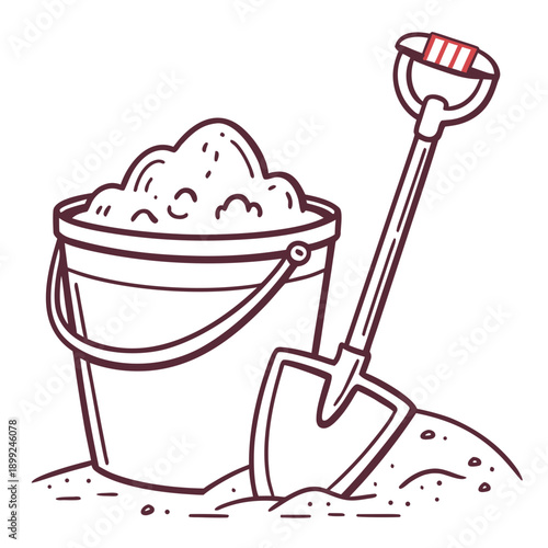 A bucket filled with sand and a shovel resting beside it on a beach.