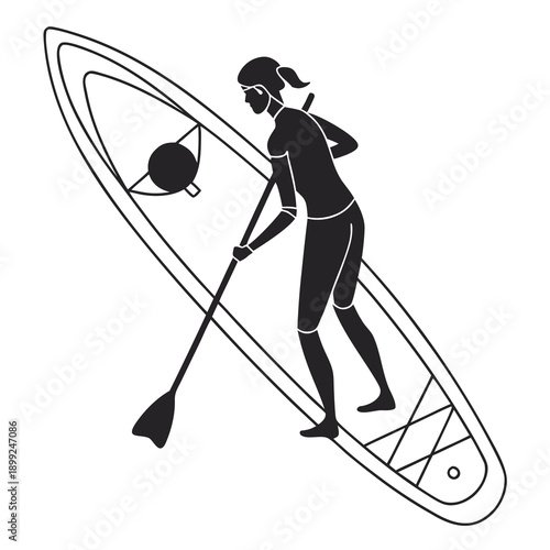 Woman in wetsuit standing on a paddle board with a paddle in hand