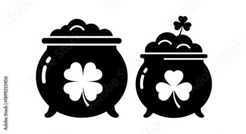 Two black silhouette pots of gold with shamrocks, symbolizing St. Patrick's Day and Irish luck and folklore.