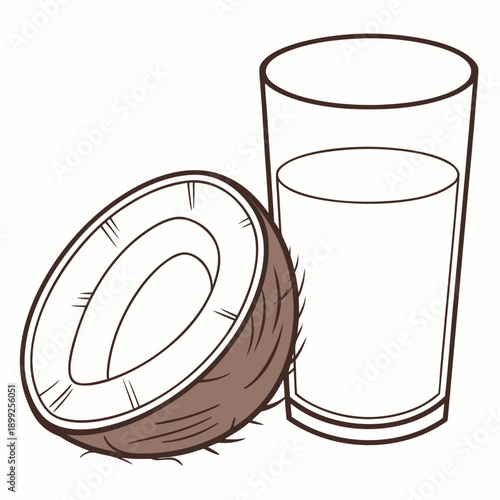 A glass of refreshing coconut water with a halved coconut on the side.