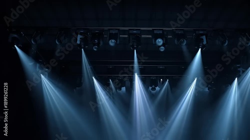 Stage Lights Illuminating a Dark Venue with Blue Hues.