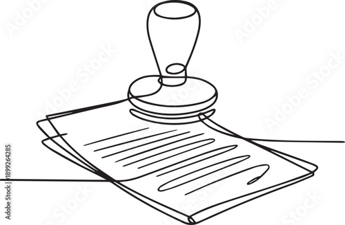 Official document being stamped with a rubber stamp on a flat surface viewed from above