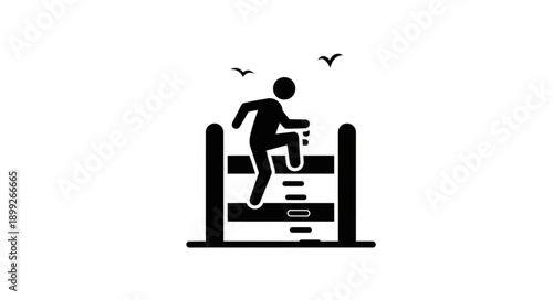 Silhouette of a person jumping over an obstacle during a race.