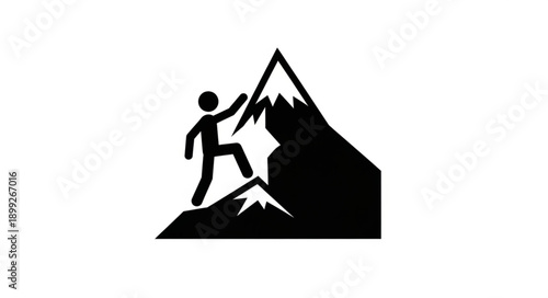 Silhouette of a person climbing a mountain peak.