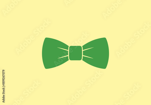 Elegant Green Bow Tie Accessory Centered on a Pale Yellow Background Simple Icon Design Element Isolated Object Apparel Fashion