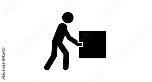 Silhouette of a person pushing a large black box.