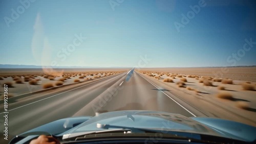 Wallpaper Mural Driver holding a map inside a car on a desert road Torontodigital.ca