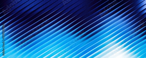 Grainy abstract background texture of blue corrugated surface with diagonal lines and gradient from dark to light blue, macro detail of ribbed material structure