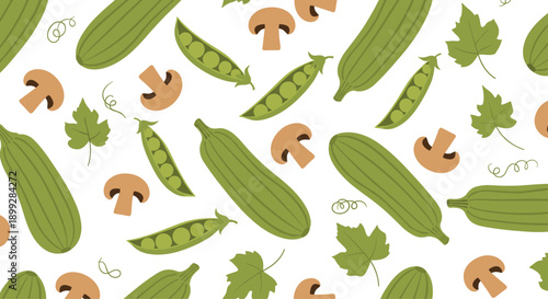 Healthy food pattern featuring green zucchini fresh peas brown mushrooms and autumn leaves scattered on white background.
