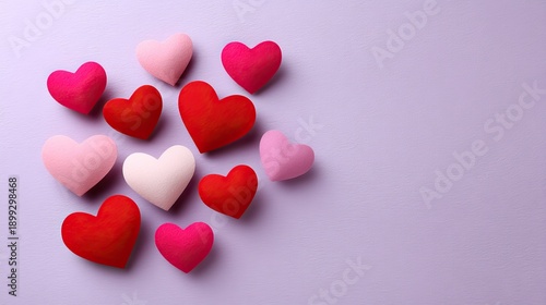 Colorful Heart Shapes on a Soft Purple Background for Romantic and Loving Themes in Crafts, Celebrations, and Decorative Projects