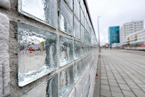 A wall with many small square glass panes
