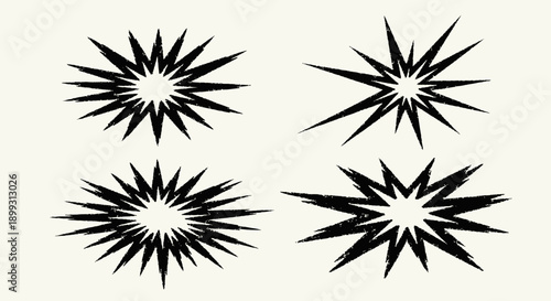 Four black abstract starburst or explosion graphic elements on a light background.